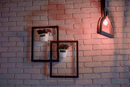 The decor on the wall in the cafe. Two frames with flowers.