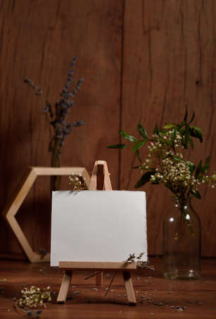 Easel with an inscription card and a sprig of lavenderの写真素材