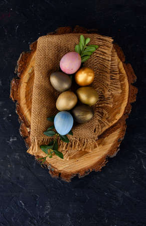 Quail eggs in rustic style on a dark background.の写真素材