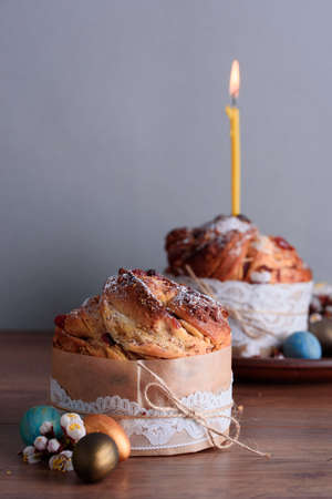Delicious Easter cakes with candle and quail eggs