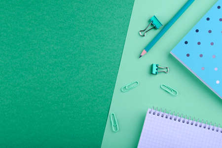 Notebook with a pencil on a colored backgroundの写真素材