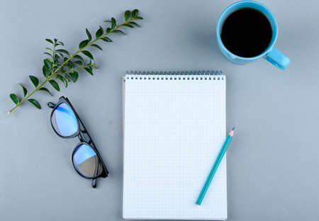 Phone, glasses, pencil, coffee, notebook on the background.の写真素材