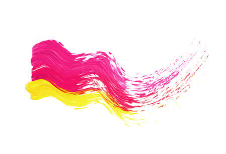 Smear of pink and yellow paint isolated on white background.の写真素材