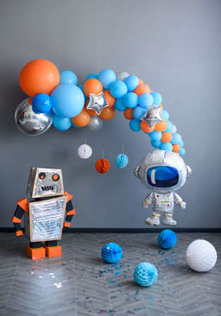 Beautiful and childish decor of gel balls in beautiful colors. In the style of a robot and space.