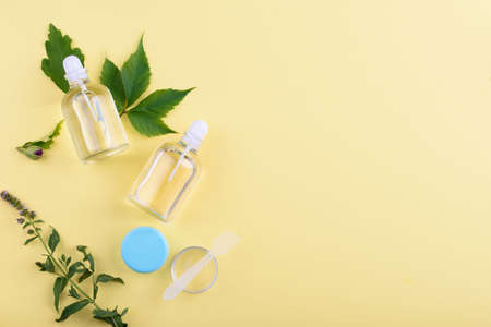 Beautiful layout of cosmetic products on yellow background . Natural cosmetic.place for text . top...