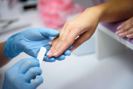 Manicurist at work, manicure nails. Manicure process Instrumentsの写真素材