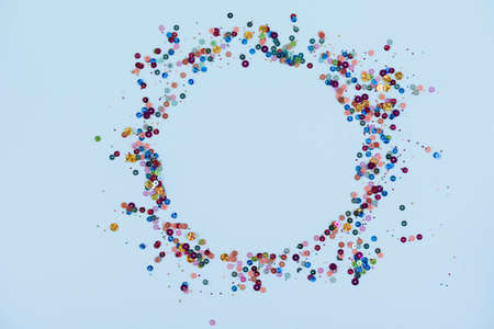 Christmas frame with gold snowflakes. Border of sequin confetti. Glitter powder sparkling backgroundの写真素材