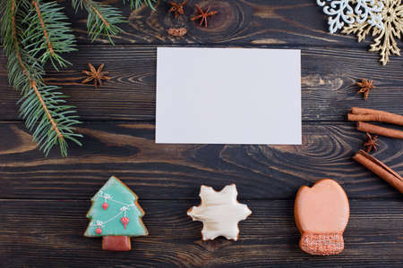 Greeting card for an inscription. Christmas gingerbread cookies, sprig of spruce, cinnamon sticks. New Year 2020の写真素材