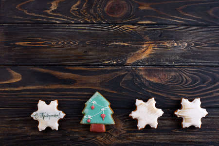 Greeting card for an inscription. Christmas gingerbread cookies, sprig of spruce, cinnamon sticks. New Year 2020の写真素材