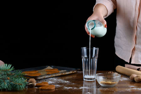 The atmosphere of Christmas holidays, the aroma of gingerbread, sprigs of spruce, gifts.の写真素材