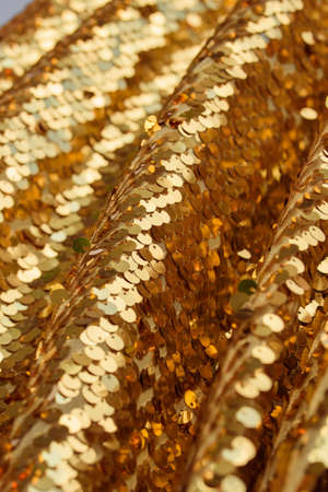 Background sequin. sequin BACKGROUND. glitter surfactant. Holiday abstract glitter background with blinking lights. Fabric sequins in bright colors. Fashion fabric glitter, sequinsの写真素材