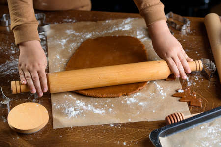 Fragrant gingerbread cookies with nuts. The process of baking gingerbread. Copy space for text,...