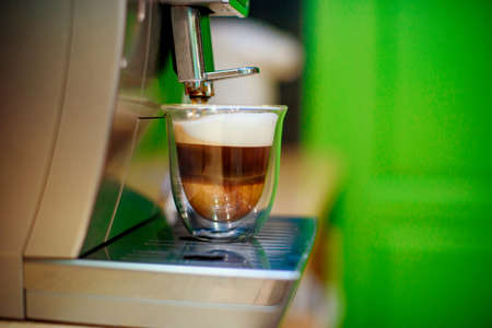 Close-up of espresso pouring from coffee machine. Professional coffee brewingの写真素材