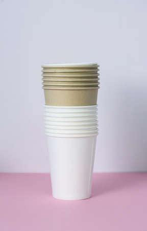Paper cups for drinks, on a pink background. Plastic replacement. Ecoの写真素材