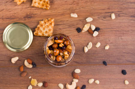 Tasty and healthy honey with nuts on the table. Waffles with honey, homemade sweets.の写真素材