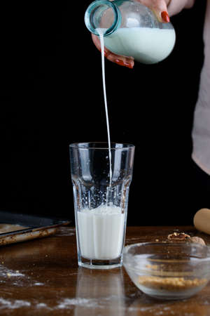 A glass of fresh molok with delicious homemade cookies. Christmas, holiday.の写真素材