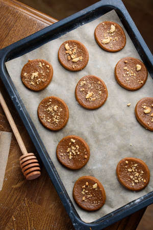 Fragrant gingerbread cookies with nuts. The process of baking gingerbread.の写真素材