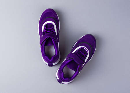 Sports shoes on a colorful background. View from above. Place for text. Flat layの写真素材