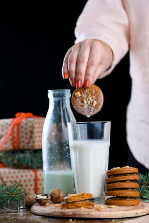 Fragrant gingerbread cookies with nuts. The process of baking gingerbread. Copy space for text, table top view.の写真素材