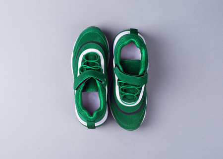 Sports shoes on a colorful background. View from above. Place for text. Flat layの写真素材