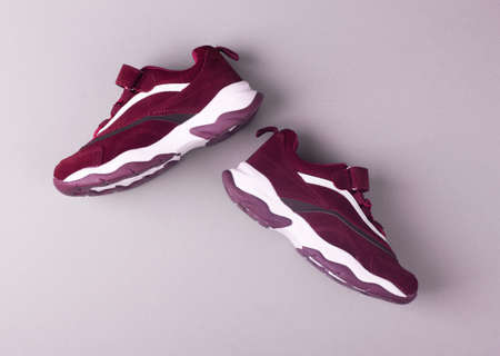 Sports shoes on a colorful background. View from above. Place for text. Flat lay