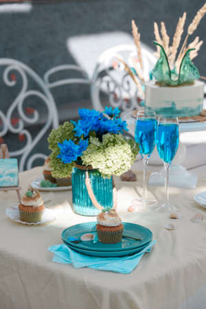 Festive table with desserts and a drink in the cafe. Decor holiday design. Deserts
