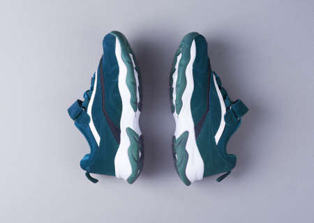 Sports shoes on a colorful background. View from above. Place for text. Flat layの写真素材