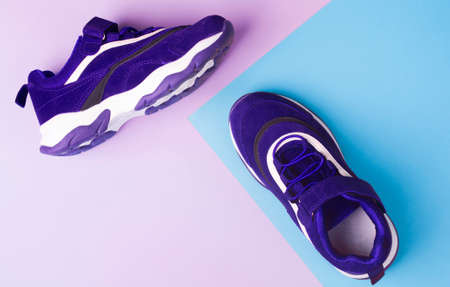 Sports shoes on a colorful background. View from above. Place for text. Flat layの写真素材