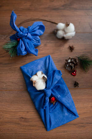 Christmas furoshiki wrapping. Etnical hristmas gift. Zero-waste christmas guide.の写真素材