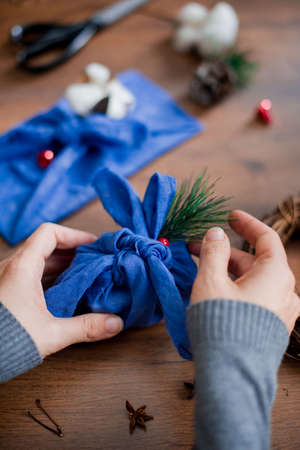 Christmas furoshiki wrapping. Etnical hristmas gift. Zero-waste christmas guide.
