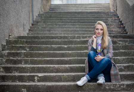 Autumn photo walk around the city with a beautiful girl.の写真素材