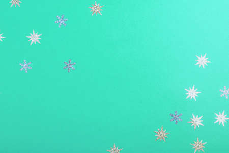 Beautiful festive mint background with silver stars.