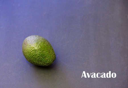 Avocado top view on a dark background . Place for copy. Flat layの写真素材