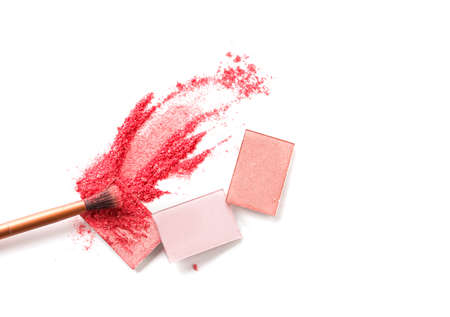 Multicolored crushed eyeshadows with brush isolated on white background. Make upの写真素材
