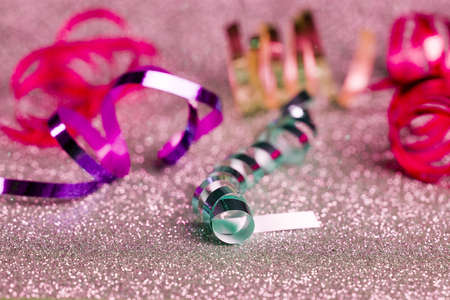 Festive content on a glittery background of gold color with serpentine, toys, sparkles. Flat lay 2020の写真素材