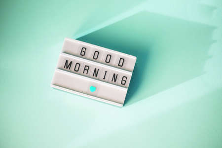 Lightbox with the words good morning on a mint background. Flat lay Top view Concept of rest, relax,...