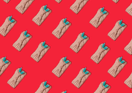Pattern on a red background of gifts in the style of furoshiki.の写真素材