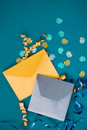 New Year's gift on a blue background, with a beautiful satin ribbon. Christmas. New Year's content. Flat layの写真素材