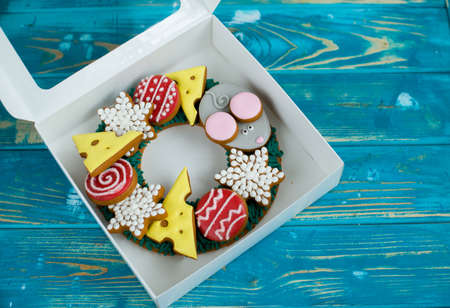 Beautiful and delicious gingerbread with pieces of cheese, mouse, balls for the Christmas tree. New...