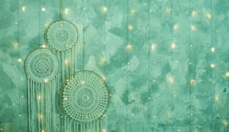 Beautiful dream catcher on the wall with lights. Boho handmade. Styleの写真素材