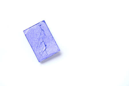 Multicolored crushed eyeshadows with brush isolated on white background. Make upの写真素材