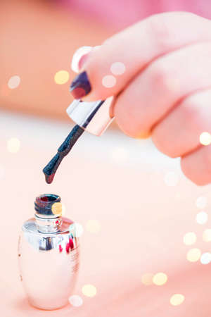 Beautiful stylish female manicure on a pink background with valentines decor. Happy valentines dayの写真素材