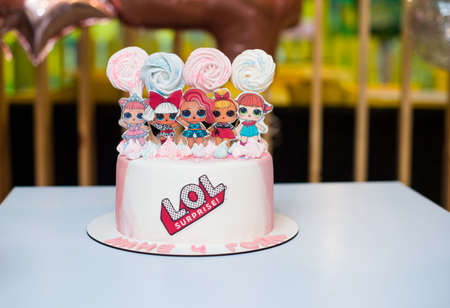 Beautiful festive and delicious cake, with decoration doll lol and marshmallow, feast. Children's...