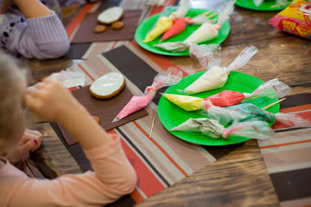 Master class on baking and painting gingerbread. Gingerbread cookies are the making process. Children's creativity.の写真素材