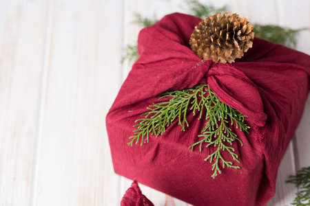 Christmas furoshiki wrapping. Ethical christmas gift. Zero waste concept 2020の写真素材