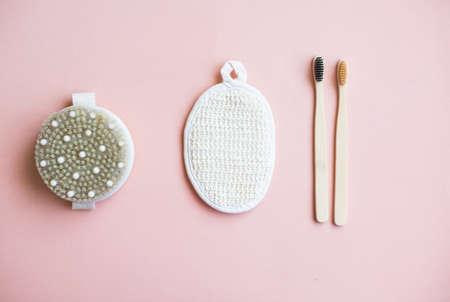 Zero waste, plastic free options for your bathroom. Reusable, repurposed glass and tin cosmetics containers. Natural soap bar, make up remover in a bottle and raw unrefined organic shea butter.の写真素材