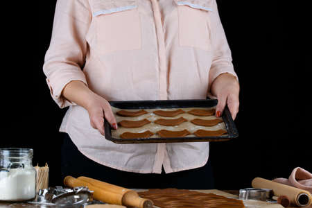 The process of making desserts. Cream cakes, muffins, cookies, groceries. The kitchen and confectioner makes desserts. Sweets.の写真素材