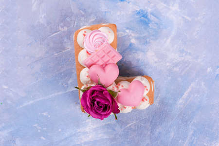 Dessert of cream, filling of cherries, cake of letters love, decorated with chocolate, merindos,...
