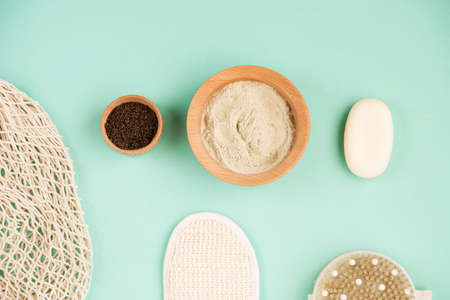 Cosmetic bath salt, grape gomaj for the face, coffee scrub for the body on a mint background. Spa cosmetic, zero waste.の写真素材