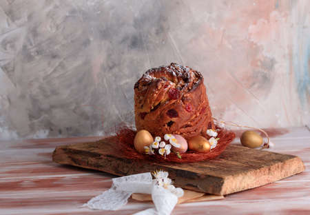 Delicious pastry baking. Easter cake with filling. Quail eggs. Flowers, table, dishes.の写真素材